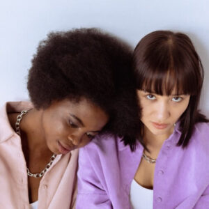 Two women are smiling and smiling for the camera